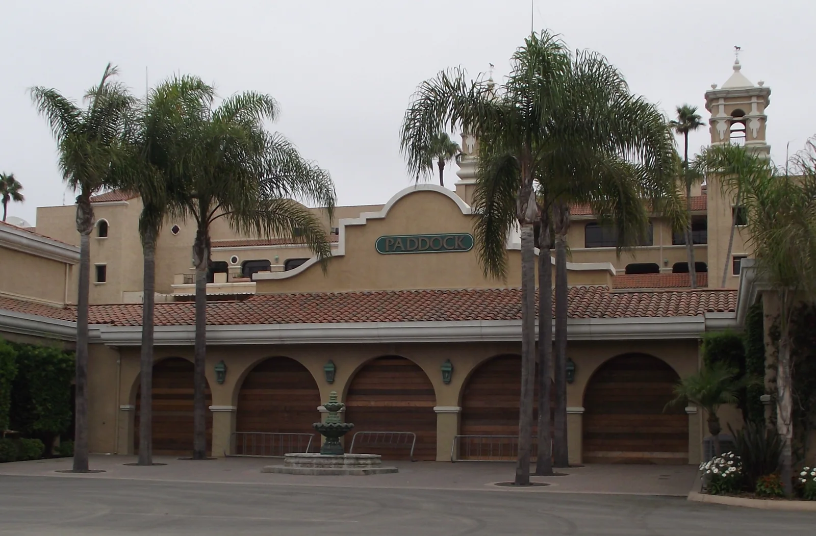 Del Mar’s paddock facade with palm trees and a fountain