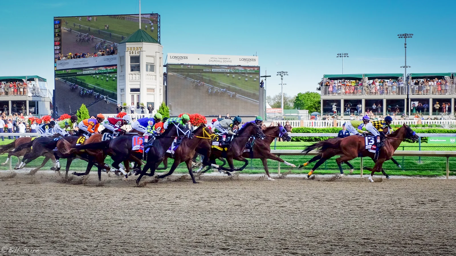 Horses racing at Churchill Downs during the 2014 Kentucky Derby