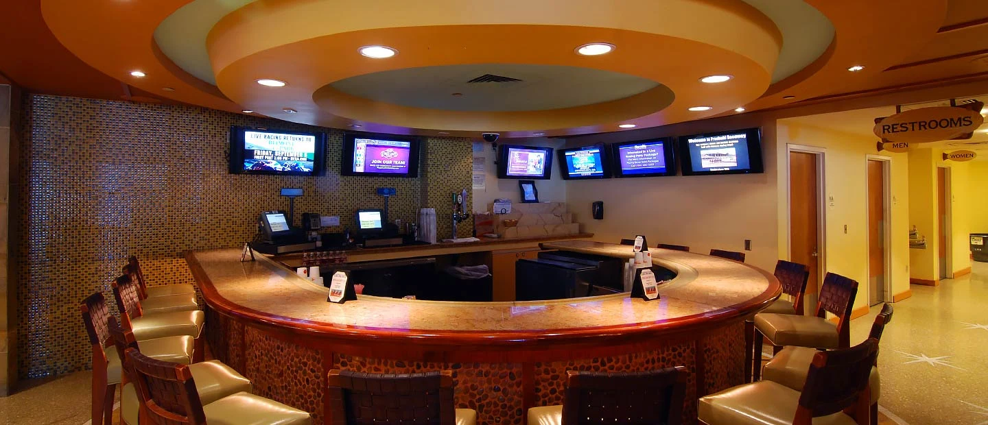 Circular counter and television screens inside the Starting Gate Bar at Mohegan Pennsylvania